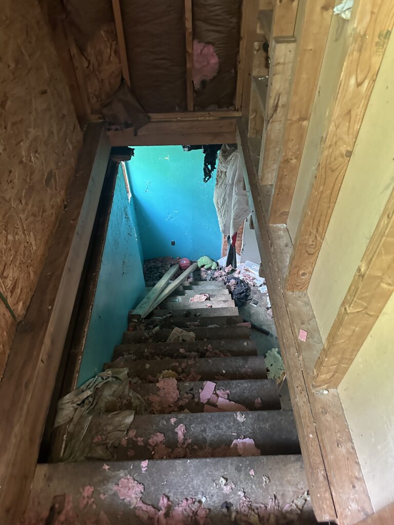 Staircase at 408 & 410 3rd Avenue, Beaver Falls PA leading to upstairs bedrooms.