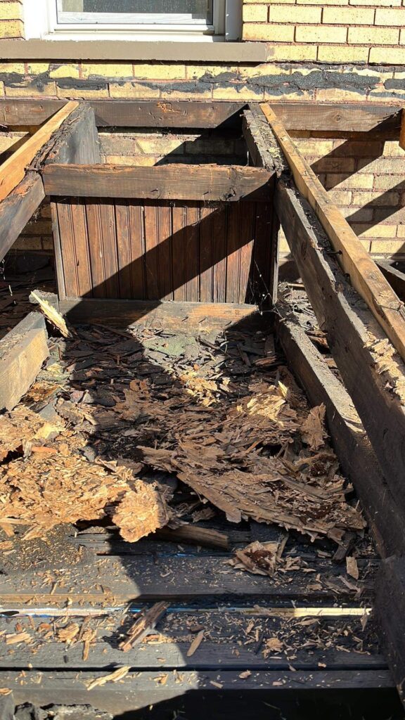 Roof replacement in progress on a real estate investment property managed by a project team.