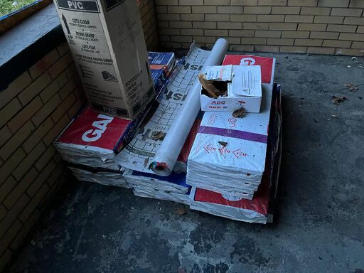 Shingle delivery and staging at flip property job site