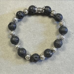 Black lava stone beads with porous volcanic texture used in handmade bracelet jewelry