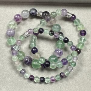 Purple and green fluorite gemstone triple stack bracelets handcrafted at The Jewelers Bench studio