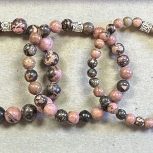 Pink and black lace rhodonite bracelet set showing natural marbled gemstone patterns and Tibetan silver spacer beads