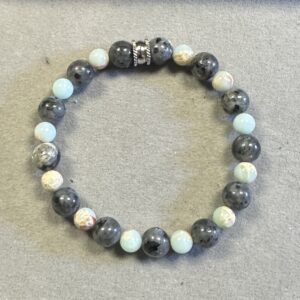 Handmade black lava and royal blue sea sediment jasper bracelet featuring matte volcanic and polished gemstone beads