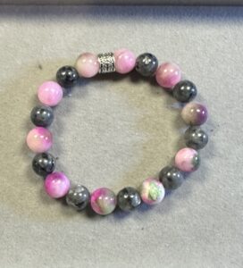 Handmade pink Persian jade and black lava stone bracelet with natural blush and matte volcanic gemstone beads