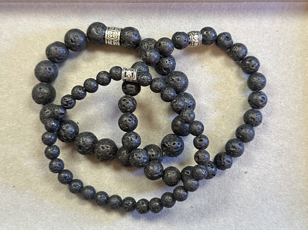 Handmade bracelet featuring textured black lava stone beads.